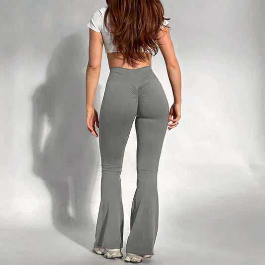 PANTALON DE YOGA LARGE ET ALLONGEANT AUX JAMBES